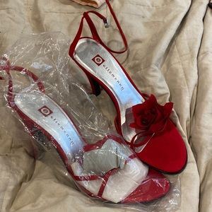 Red heels with rosette accent